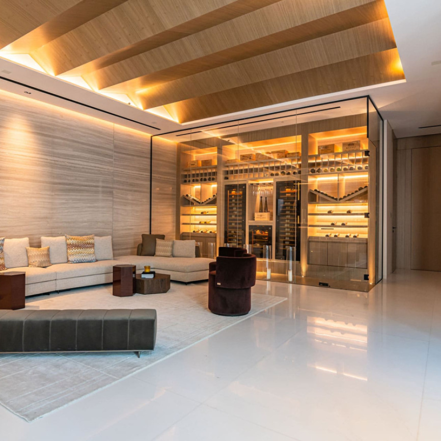 Stunning climate-controlled wine room seamlessly integrated into the interior architecture of a luxury home.