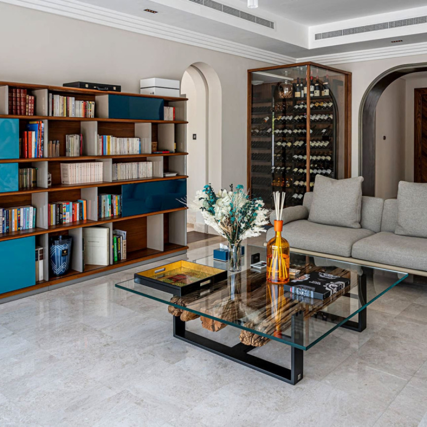 Climate-controlled wine display integrated into the living room of a modern home.