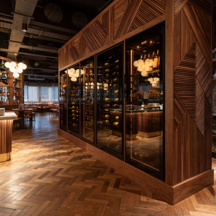 Exceptional wall of high-end glassed wine fridges featuring EuroCave Royale, Revelation and Champagne models.
