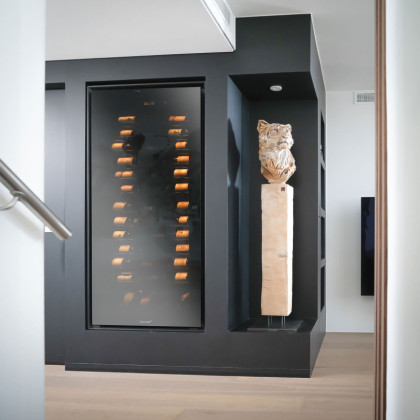 Bespoke furniture housing a EuroCave Royale cabinet for ultimate wine aging.